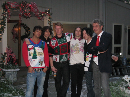 The chef and the band posing for a picture